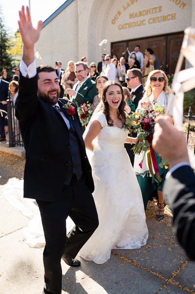 Newlyweds walking together after their ceremony