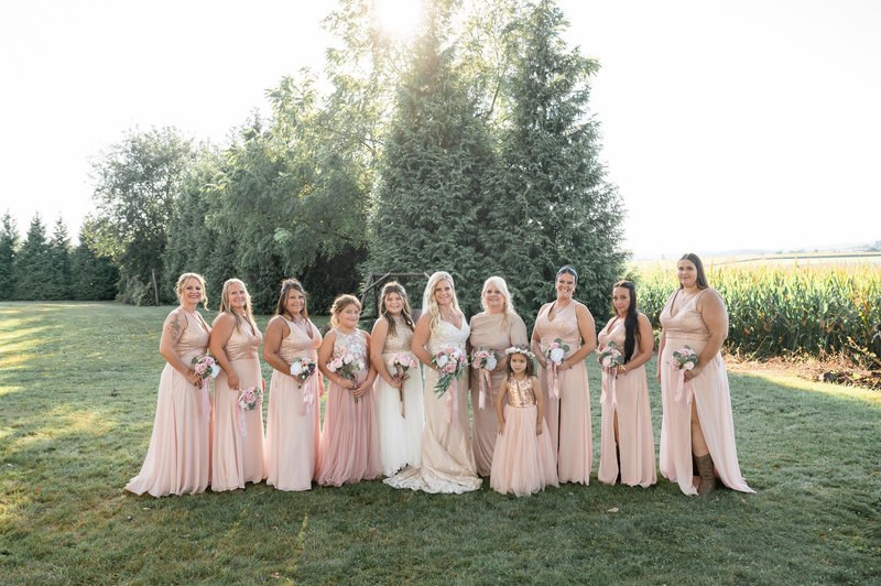 Bride with her bridesmaids outdoors