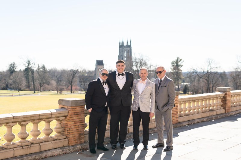 Groom with family outdoors