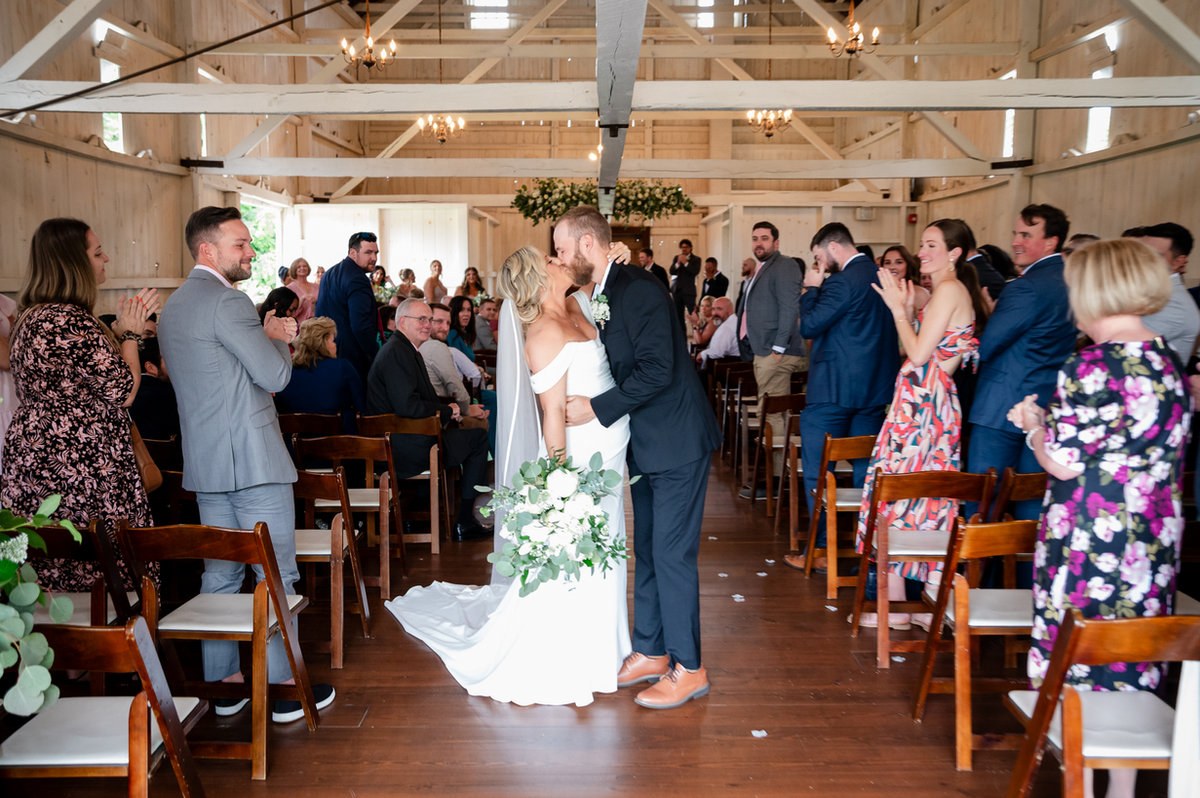 Newlyweds celebrating their exit from the ceremony